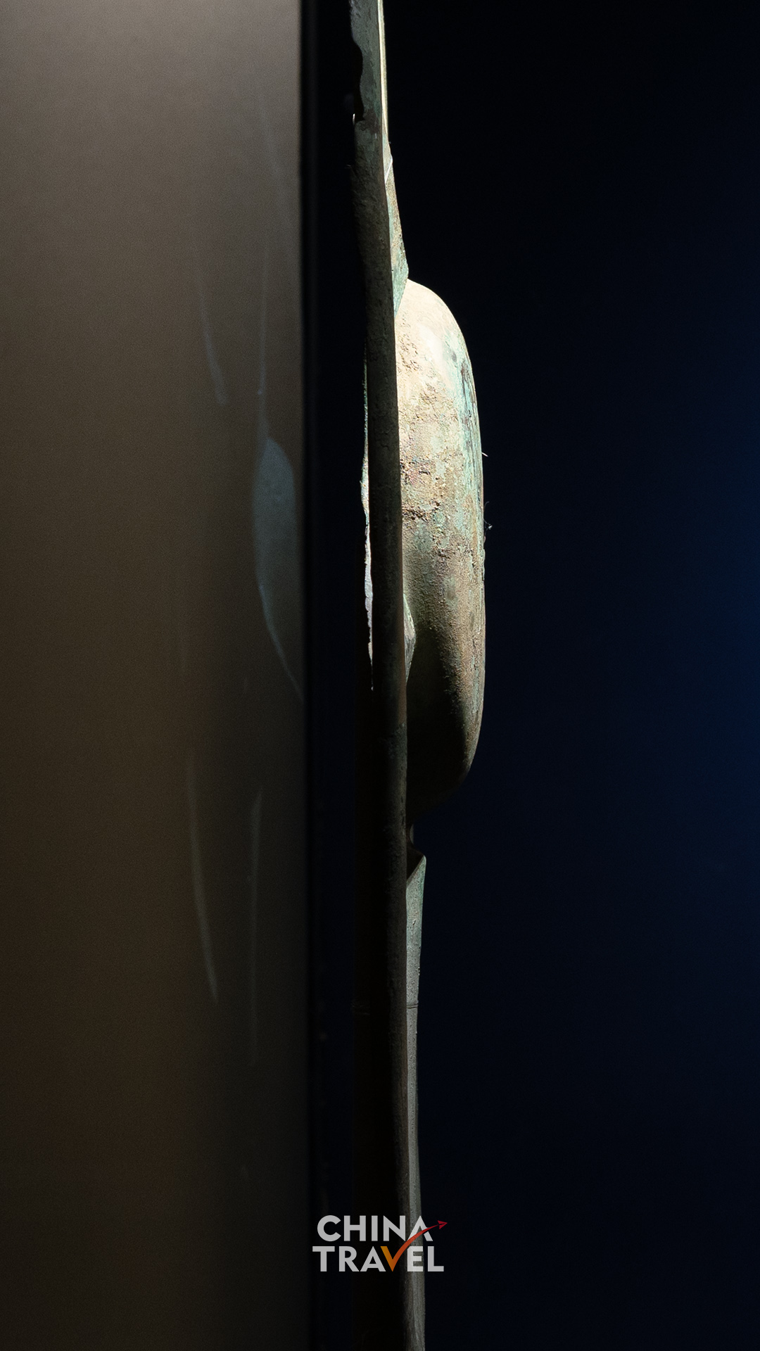 Close and side views bring the raised center, surface texture and depth of the bronze into focus. /CGTN