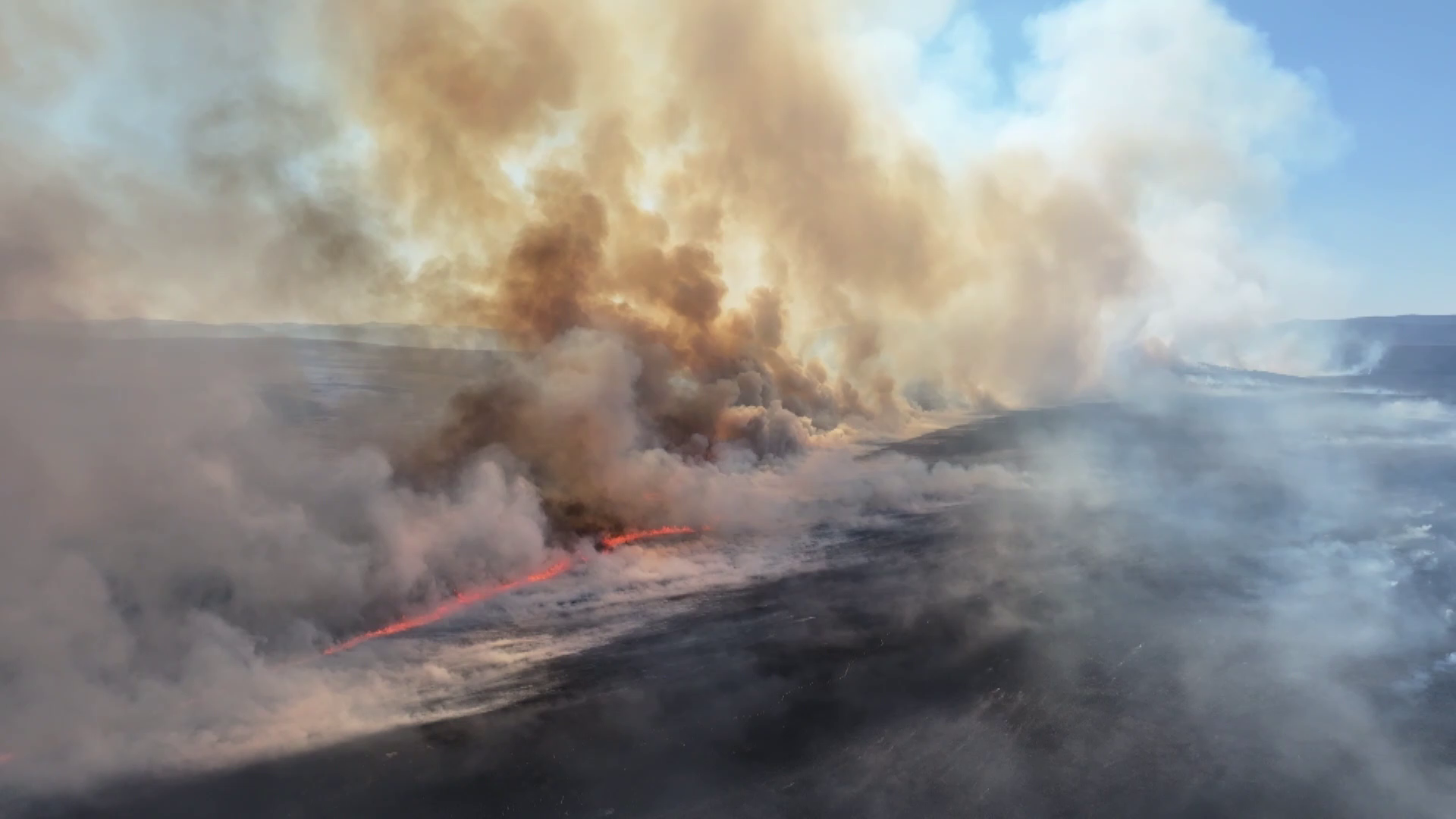 An aerial drone view shows a grassland fire burning near the border, north China's Inner Mongolia Autonomous Region. /China Media Group