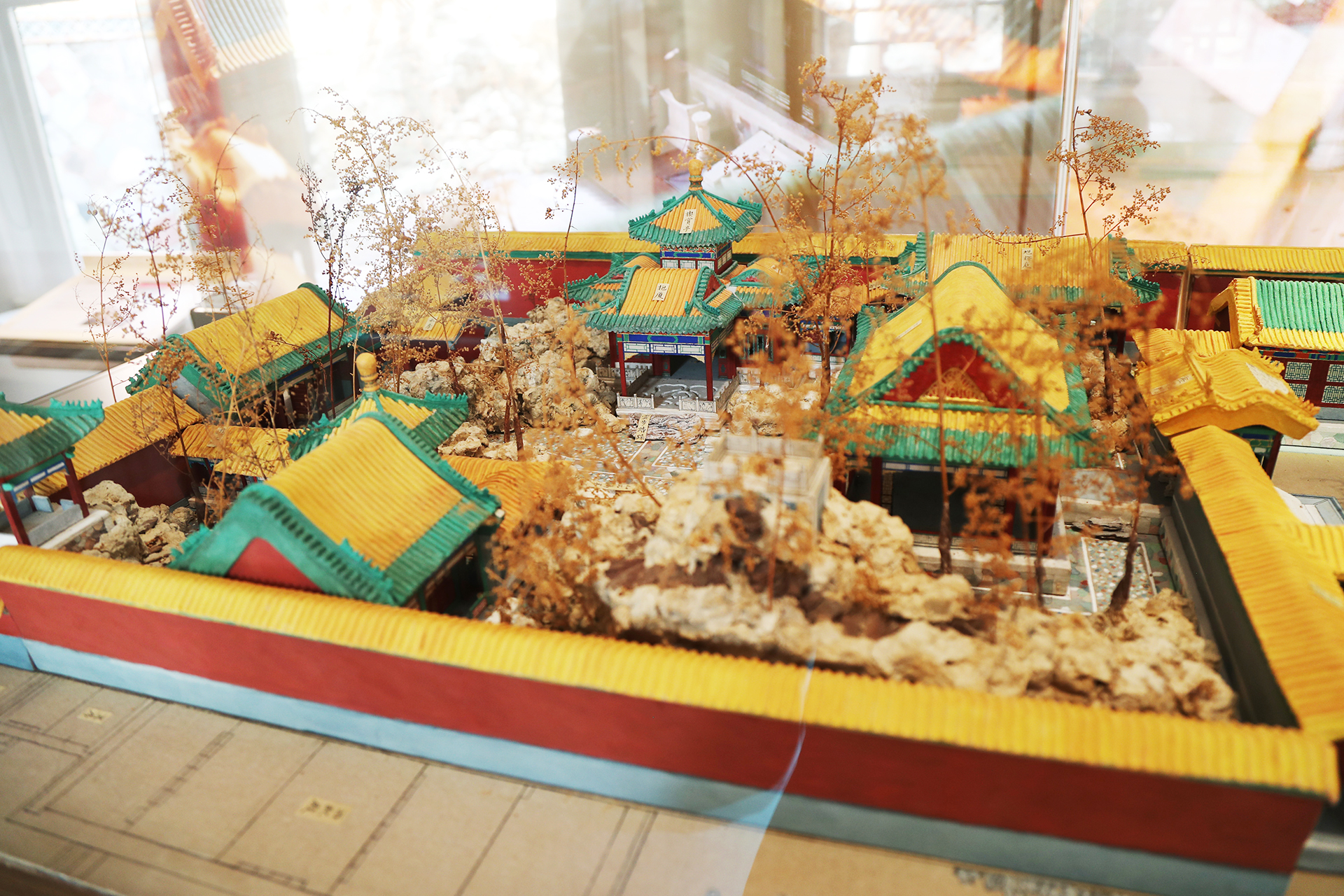 A view of the re-created ironed paper models of the Qianlong Garden on display at the Palace Museum in Beijing. /CGTN