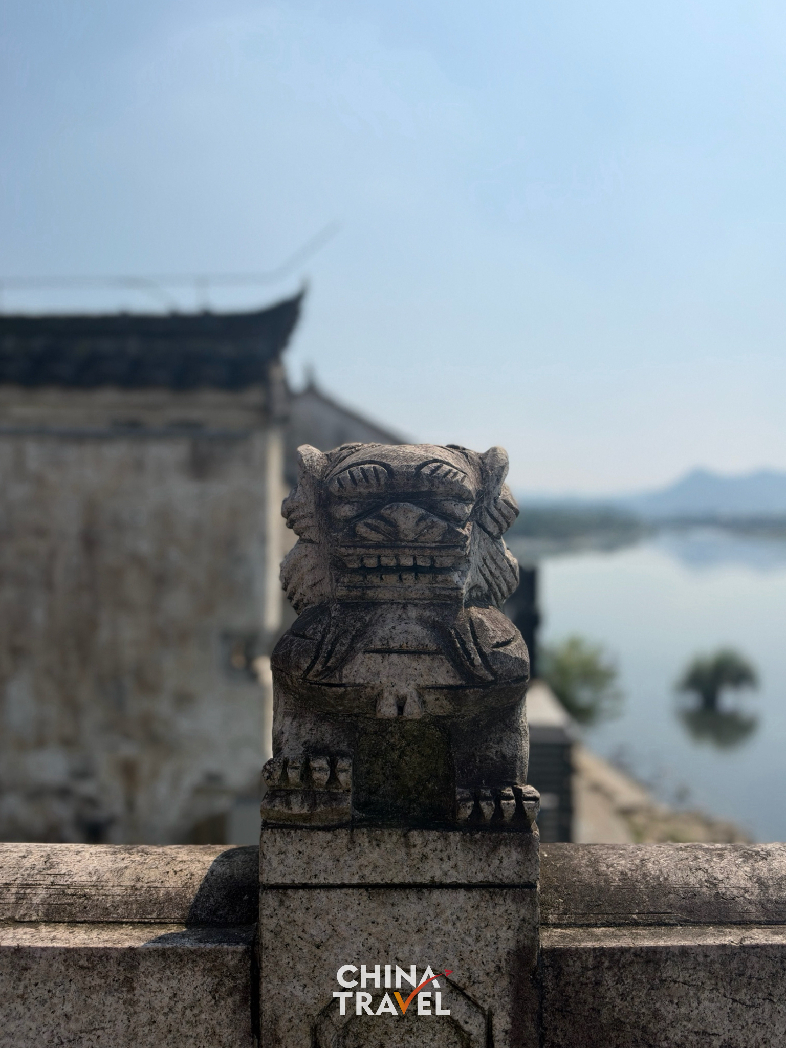 A 500-year-old stone lion carved on the balustrades of Yongfu Bridge, built to ward off floods and protect travelers. /CGTN