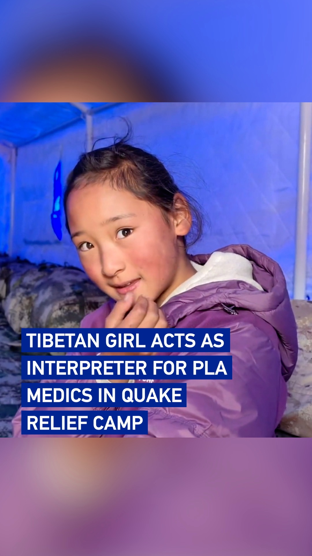 Tibetan girl acts as interpreter for PLA medics in quake relief camp