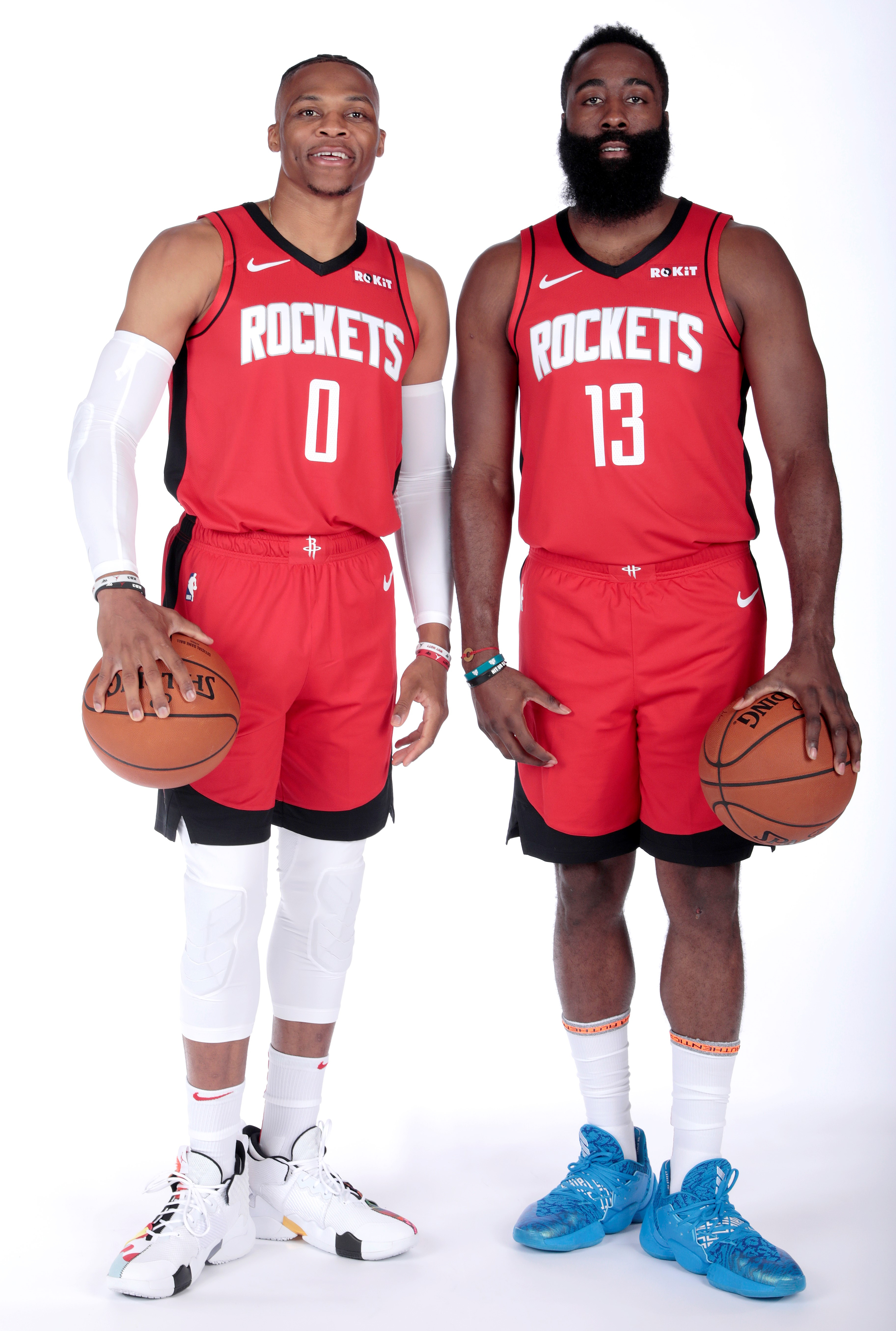 Russell Westbrook (L) and James Harden (R) of the Houston Rockets pose to t...
