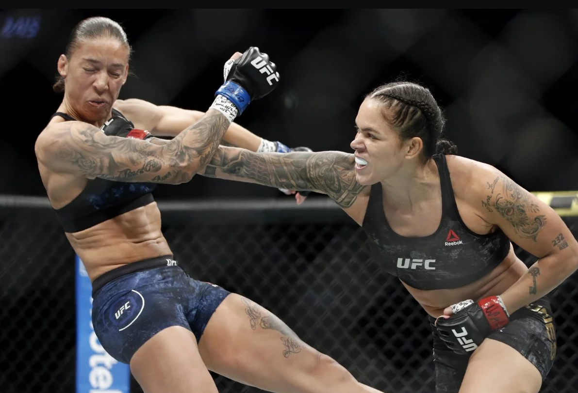 Amanda Nunes hits Germaine de Randamie with a hard right at UFC 245 /AP Spo...