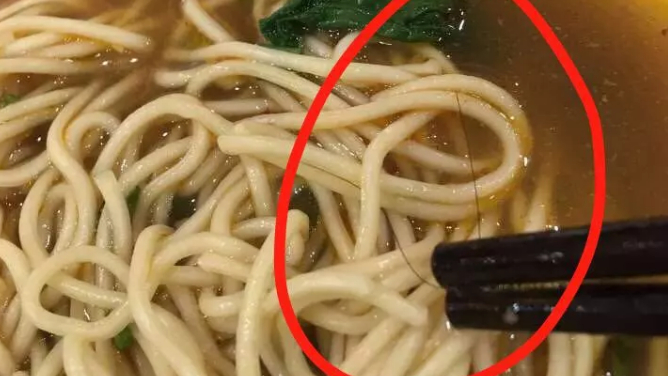 Customer wins 1,016 yuan in lawsuit for hair found in a 16-yuan bowl of  noodles - CGTN