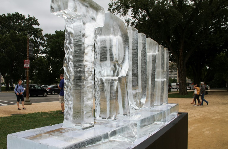 Melting ice sculpture protests fake news at US Capitol CGTN