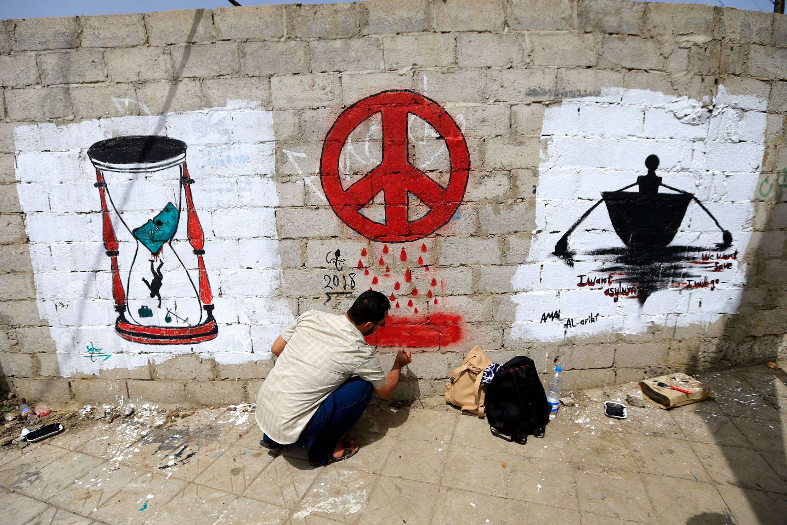 Yemeni artists call for peace by painting antiwar graffiti CGTN