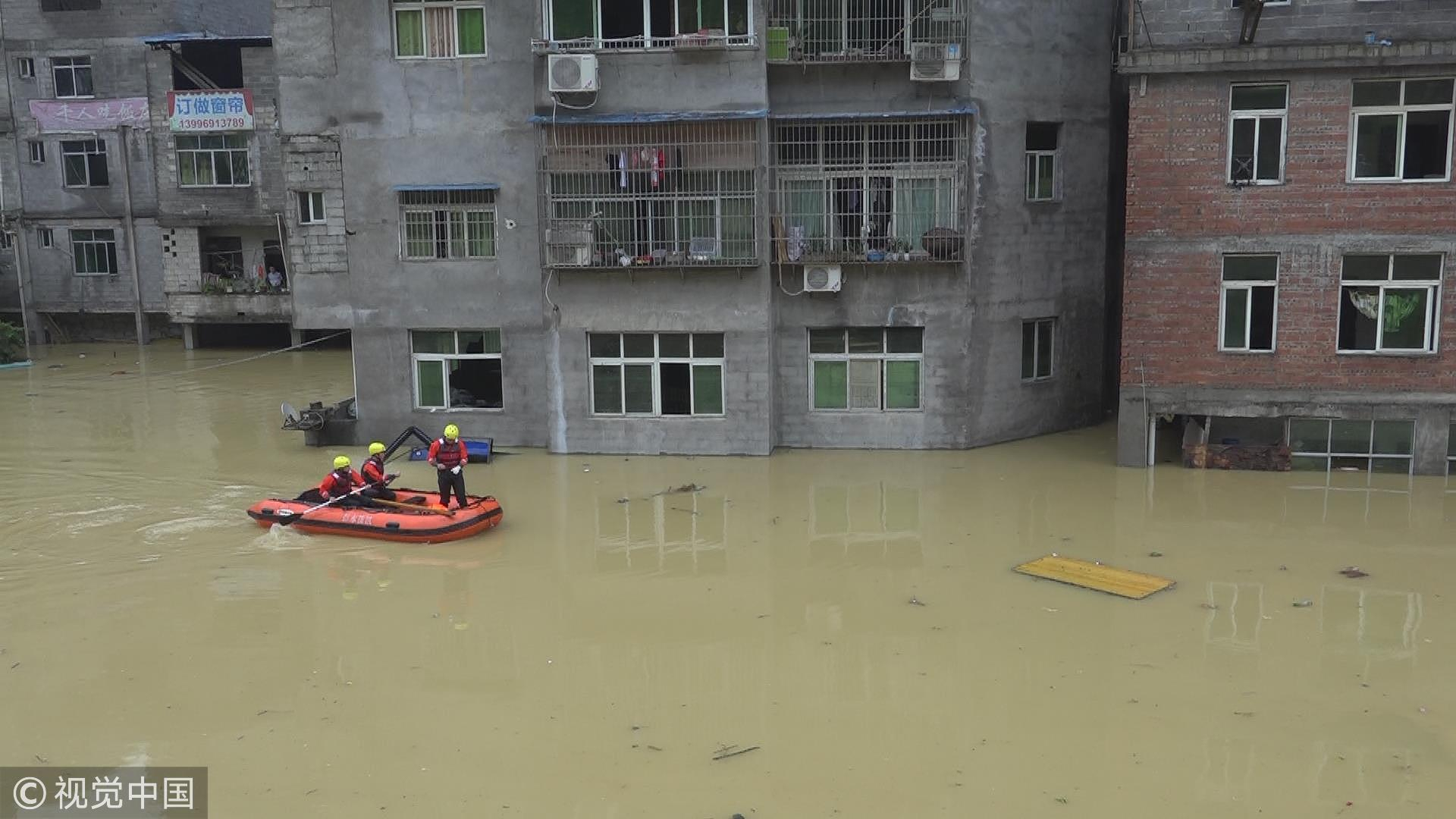 China’s firefighters use raft to relocate people stranded by rainstorm ...