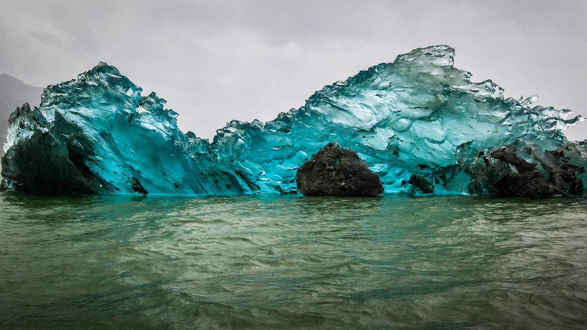 The bottom of an iceberg has beautiful colors, where is the origin?