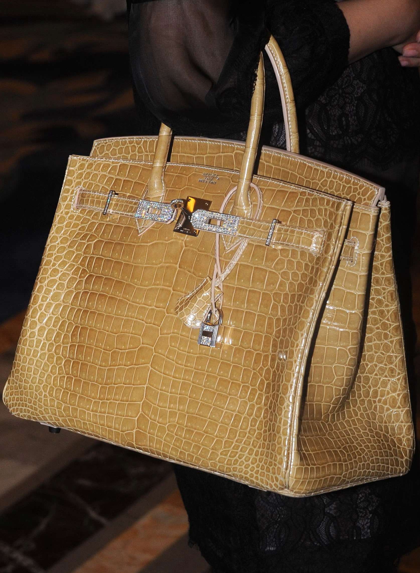 Diamond-encrusted purse sells for record $380,000 at auction