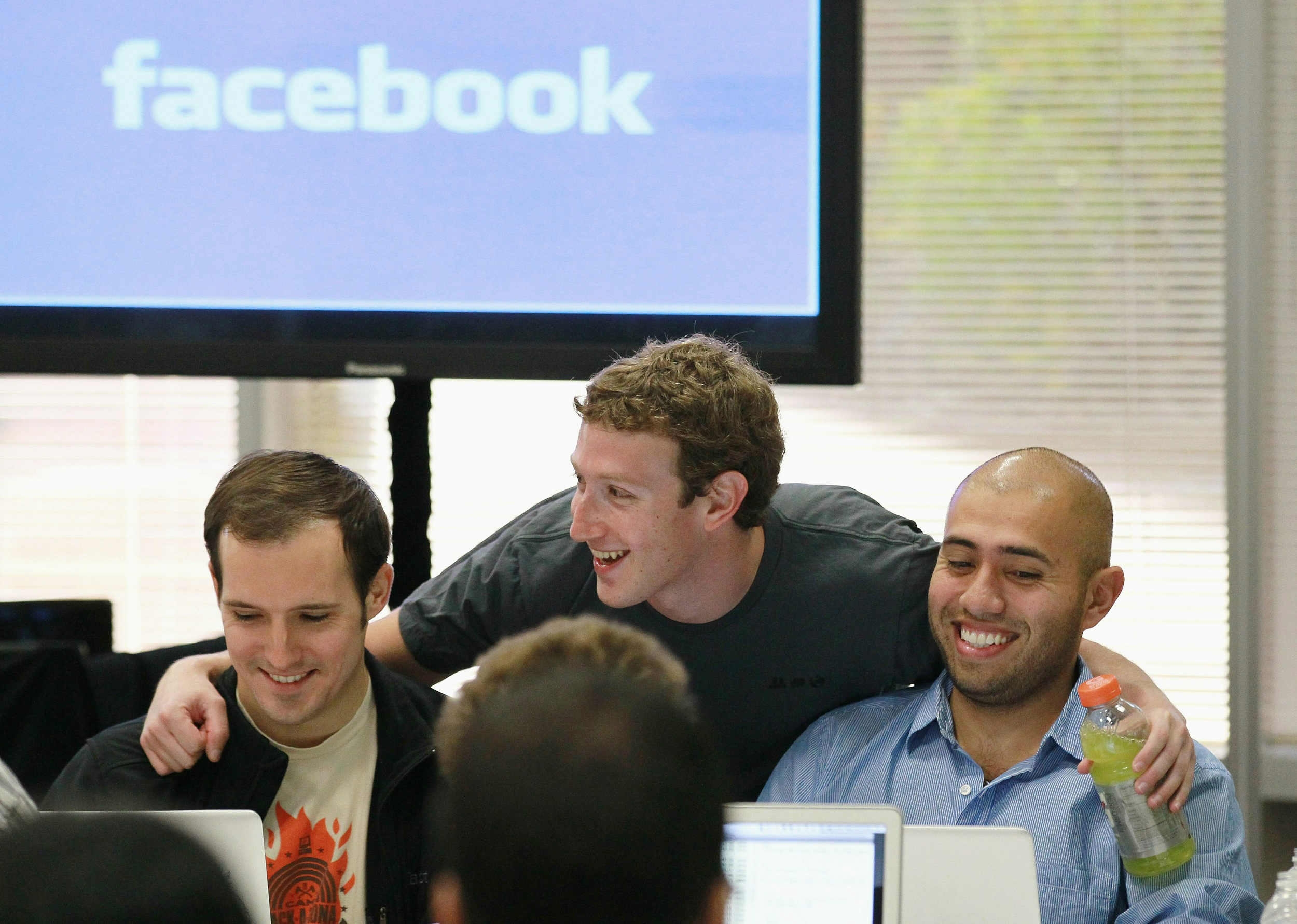 Facebook founder and CEO Mark Zuckerberg (C)