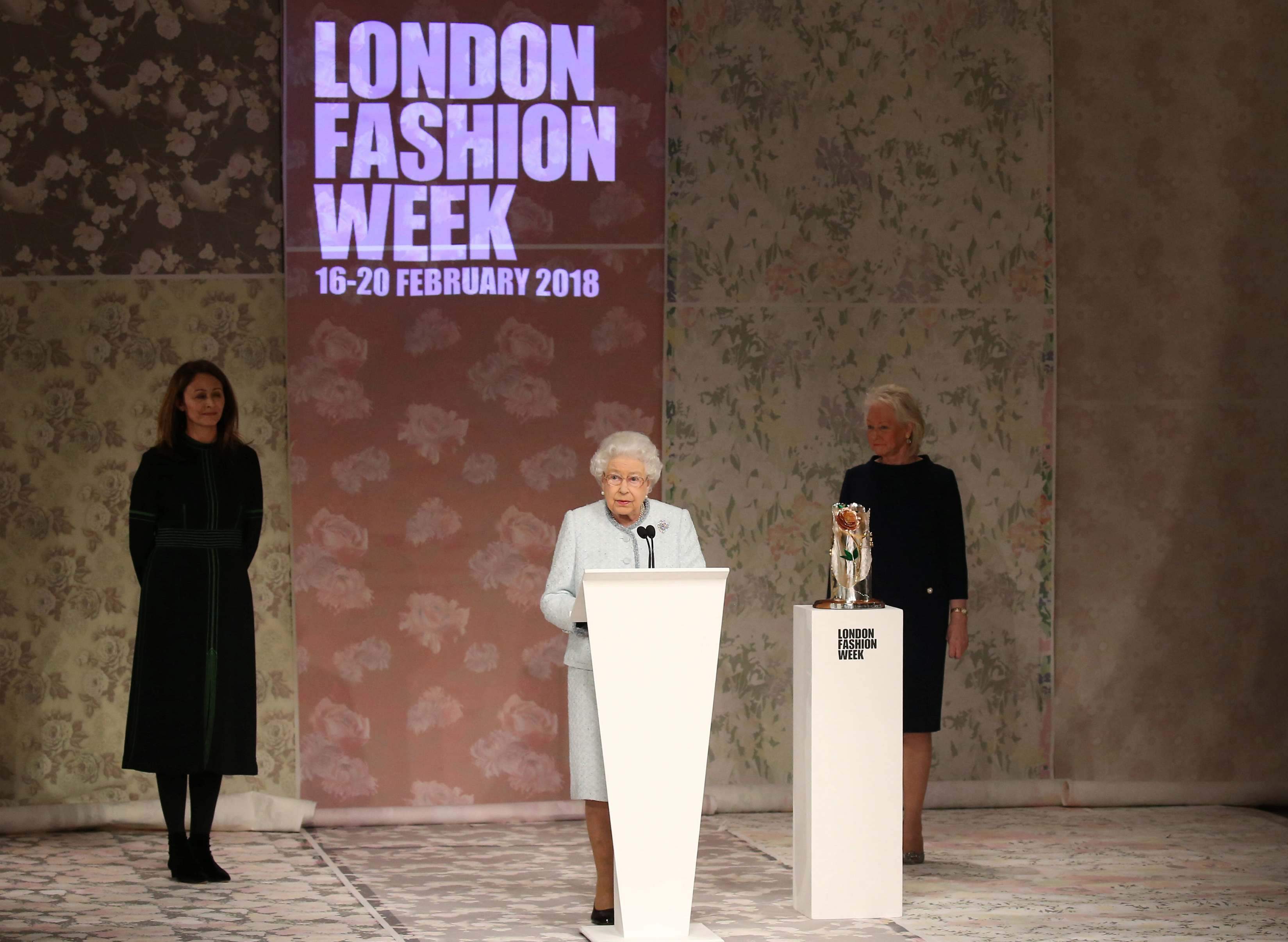 Queen Elizabeth makes surprise appearance at London fashion 